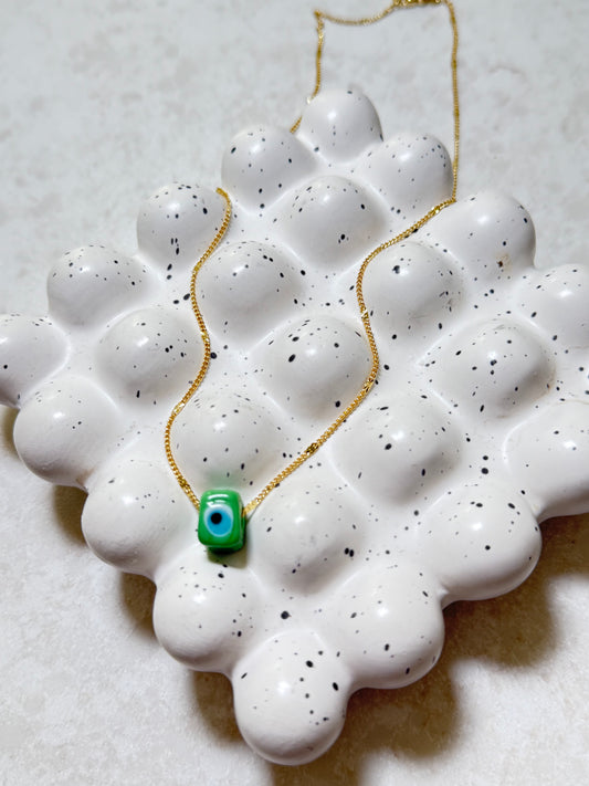 Green square evil eye